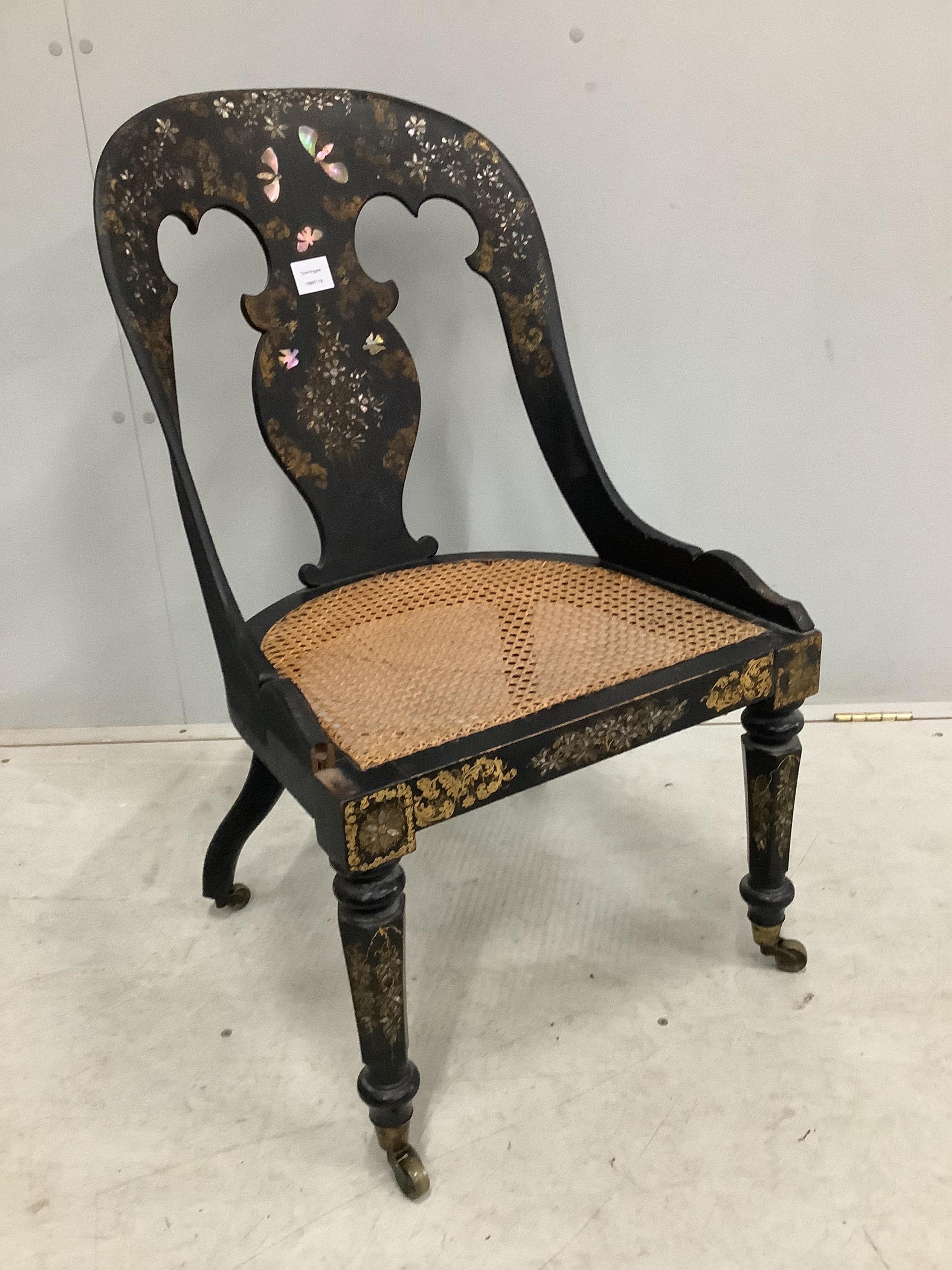 A Victorian mother of pearl inlaid papier mache cane seat chair and a Victorian painted circular tilt top wine table. Condition - fair